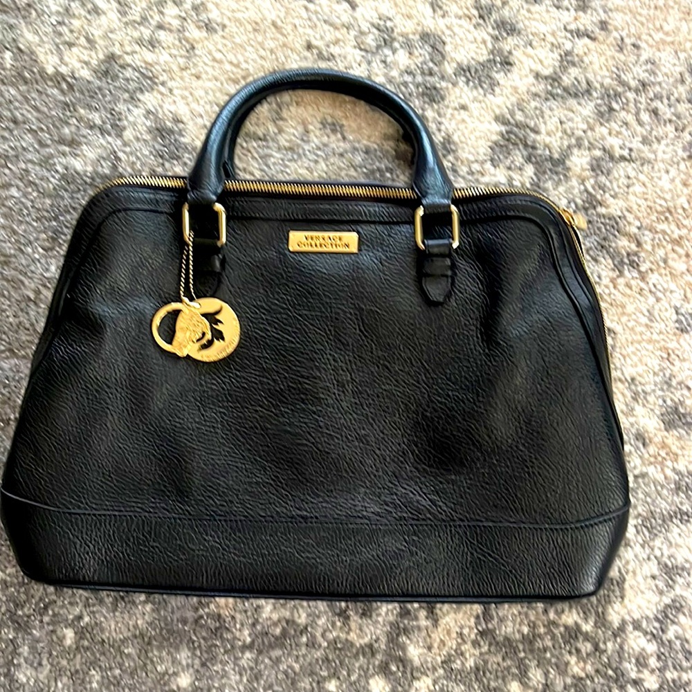 Versace collection leather authentic purse . Black with gold accents